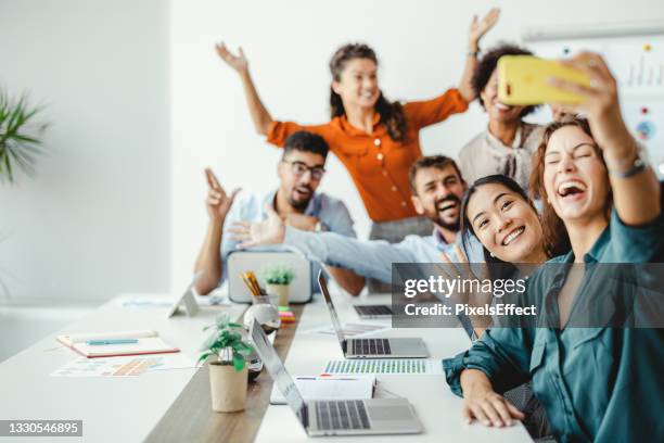 adding a splash of fun into their workday - office fun stock pictures, royalty-free photos & images