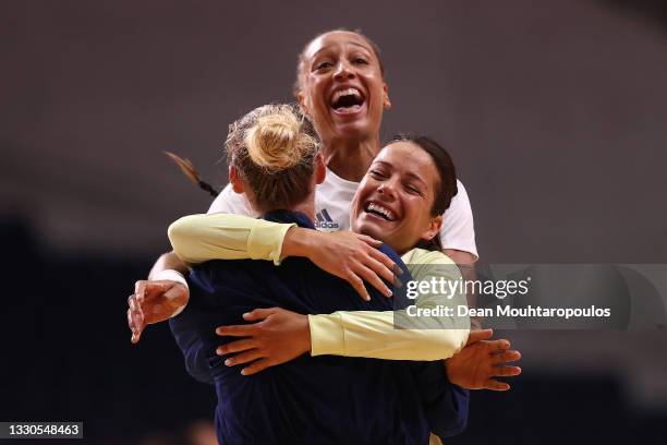 Amandine Leynaud, Cleopatre Darleux and Beatrice Edwige of Team France celebrate together after winning Women's Preliminary Round Group B match...