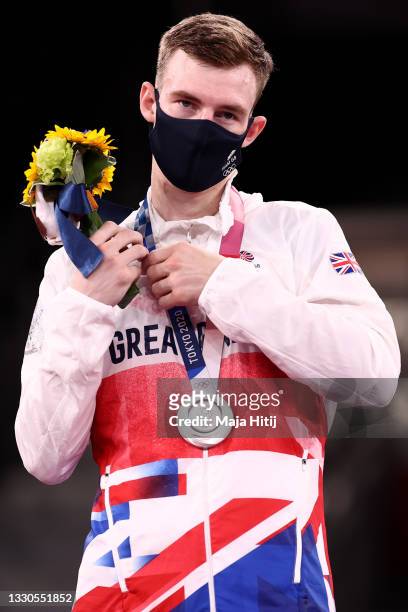 Silver medalist Bradly Sinden of Team Great Britain stands on the podium for the Men's -68kg Taekwondo Gold Medal contest on day two of the Tokyo...