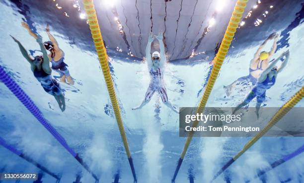 Lilly King of Team United States competes in heat six of the Women's 100m Breaststroke on day two of the Tokyo 2020 Olympic Games at Tokyo Aquatics...