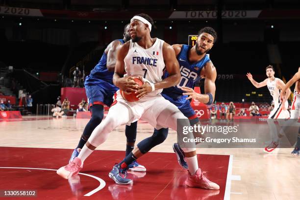 Guerschon Yabusele of Team France looks to drive past Jayson Tatum of Team United States during the second half of the Men's Preliminary Round Group...
