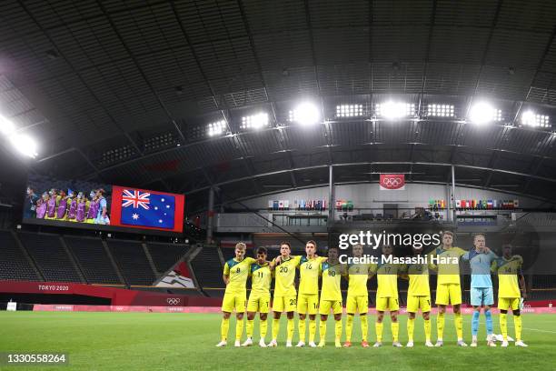 Players of Team Australia stand for the national anthem prior to the Men's First Round Group C match between Australia and Spain on day two of the...