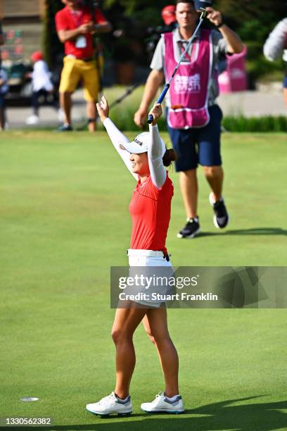 Tournament winner Minjee Lee of Australia celebrates on the eighteenth green during day four of the The Amundi Evian Championship at Evian Resort...