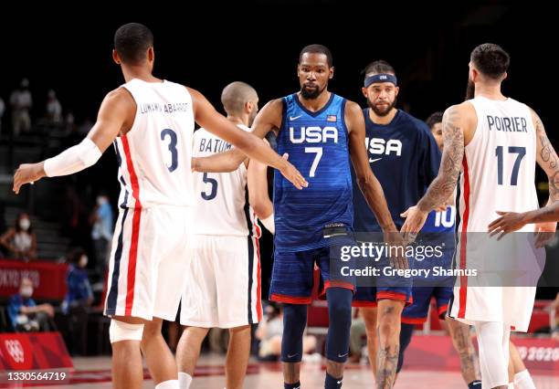 Kevin Durant of Team United States shakes hans with members of Team France following their Men's Preliminary Round Group B game on day two of the...