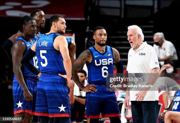 Coach Gregg Popovich of the USA talks to his players during the preliminary rounds of the Men's Basketball match between the USA and France on day...