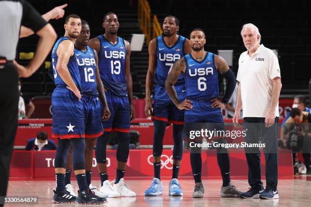 Zachary Lavine, Jrue Holiday, Bam Adebayo, Kevin Durant, Damian Lillard and Head Coach Gregg Popovich of Team United States of America look on in...