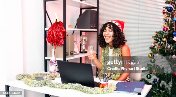 happy girl spending christmas holiday at the office - christmas party office stock pictures, royalty-free photos & images