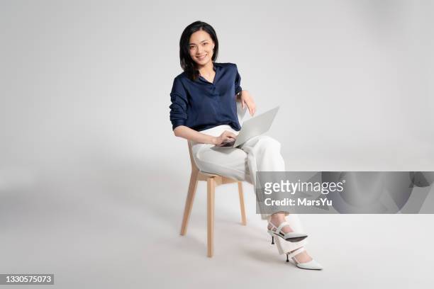 portrait of beautiful woman using laotop - design studio woman chinese laptop bildbanksfoton och bilder