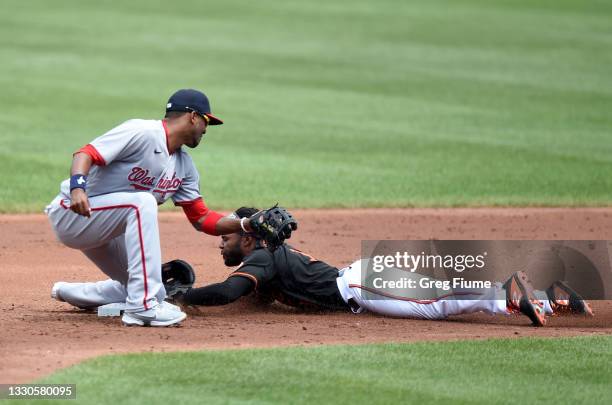 Cedric Mullins of the Baltimore Orioles is tagged out trying to steal second base in the third inning by Alcides Escobar of the Washington Nationals...