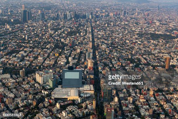 mexico,mexico city, aerial view of densely populated city at dusk - mexico city street stock pictures, royalty-free photos & images