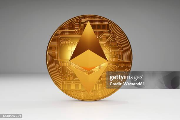 three dimensional render of gold ethereum coin - ethereum stockfoto's en -beelden