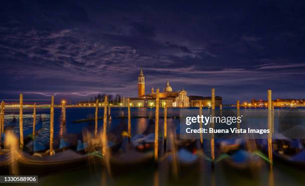 venice. gondolas in san marco square at night - saint mark stock pictures, royalty-free photos & images