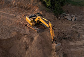 Excavator dig ground at construction site. Foundation pit for a multi-story building.