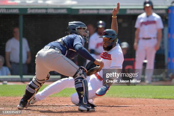 Catcher Francisco Mejia of the Tampa Bay Rays waits for the throw as Amed Rosario of the Cleveland Indians scores during the eighth inning at...