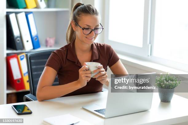 young woman using laptop and working - mentoring virtual stock pictures, royalty-free photos & images