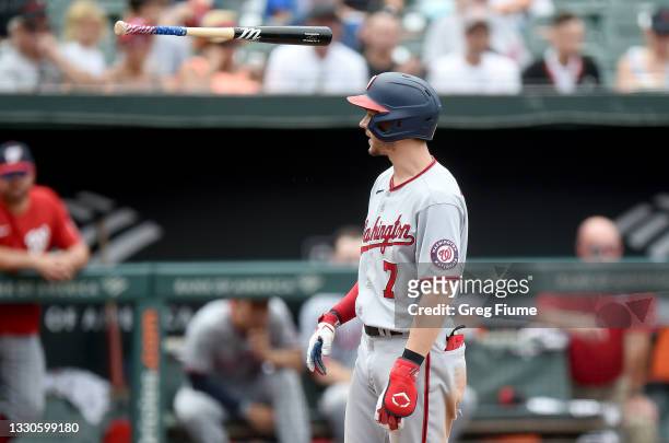 Trea Turner of the Washington Nationals throws his bat after striking out in the seventh inning against the Baltimore Orioles at Oriole Park at...