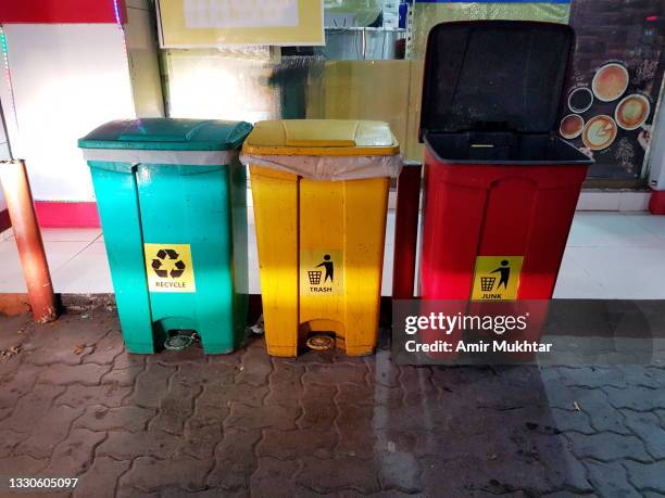 large size of plastic recycle, trash and junk bins by the road. - mixed recycling bin stock pictures, royalty-free photos & images