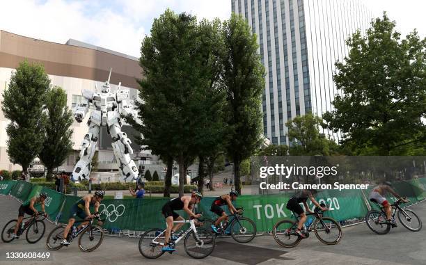 Javier Gomez Noya of Team Spain rides ahead of Hayden Wilde of Team New Zealand, Makoto Odakura of Team Japan, Igor Polyanskiy of Team ROC, Matthew...