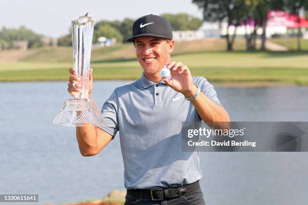 Cameron Champ poses with the trophy after winning the 3M Open at TPC Twin Cities on July 25, 2021 in Blaine, Minnesota.