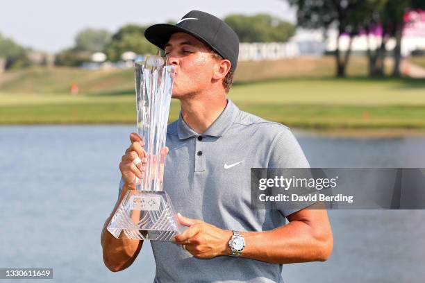 Cameron Champ kisses the trophy after winning the 3M Open at TPC Twin Cities on July 25, 2021 in Blaine, Minnesota.