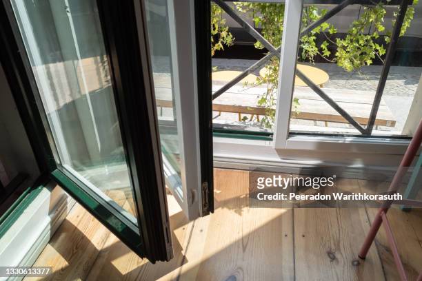 top view, lower part of folding doors or windows between corner of room. - zusammenklappbar stock-fotos und bilder