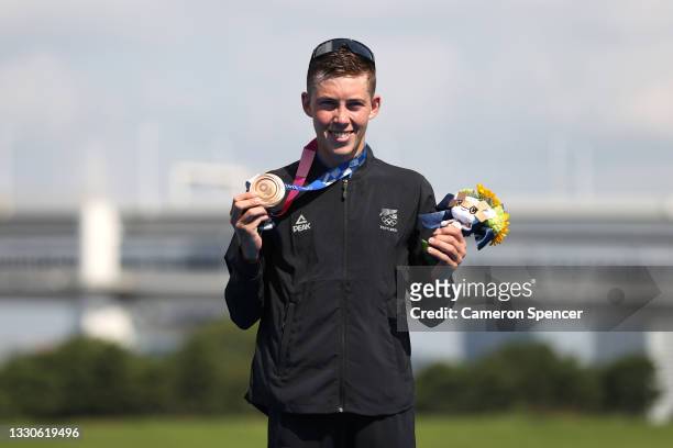 Hayden Wilde of Team New Zealand poses with the bronze medal for the Men's Individual Triathlon on day three of the Tokyo 2020 Olympic Games at...