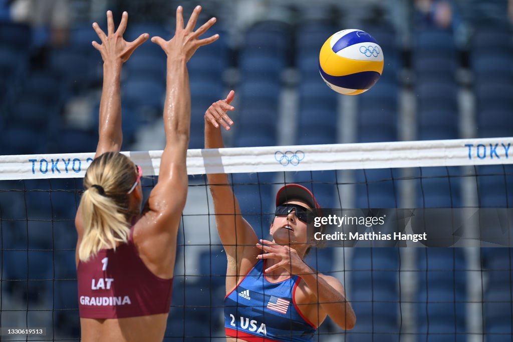 Sarah Sponcil of Team United States hits past Tina Graudina of Team Sarah Sponcil of Team United States hits past Tina Graudina of Team