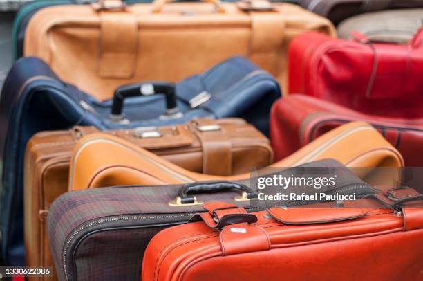 colorful suitcases and luggage - multi colored purse stock-fotos und bilder