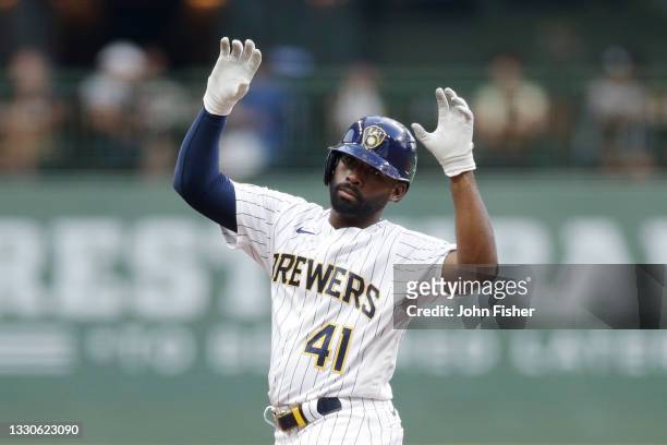 Jackie Bradley Jr. #41 of the Milwaukee Brewers reacts toward the Brewers bench after hitting a run batted in double in the fifth inning against the...