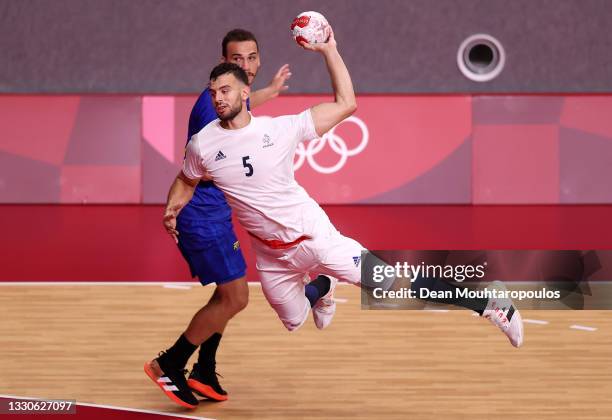 Nedim Remili of Team France shoots and scores a goal during the Men's Preliminary Round Group A match between Brazil and France on day three of the...