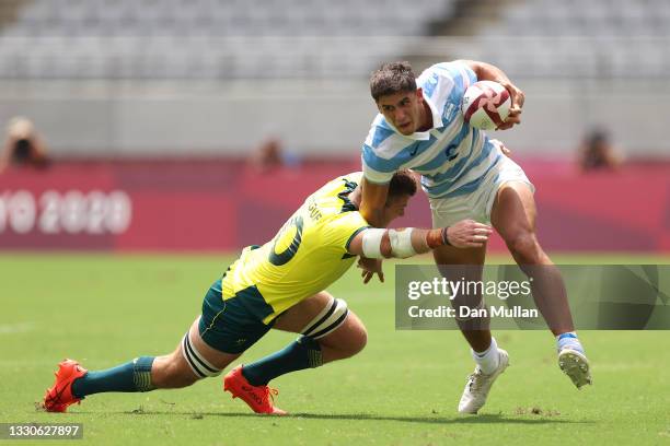 Lucio Cinti of Team Argentina is tackled by Nick Malouf of Team Australia on day three of the Tokyo 2020 Olympic Games at Tokyo Stadium on July 26,...