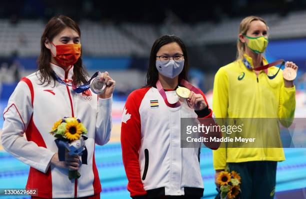 Silver medalist Yufei Zhang of Team China, gold medalist Margaret Macneil of Team Canada and bronze medalist Emma McKeon of Team Australia pose after...