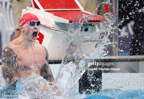 Adam Peaty of Team Great Britain celebrates after winning the gold medal in the Men's 100m Breaststroke Final on day three of the Tokyo 2020 Olympic...