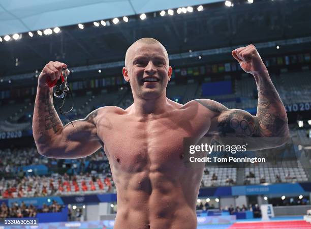 Adam Peaty of Team Great Britain reacts after winning the gold medal in the Men's 100m Breaststroke Final on day three of the Tokyo 2020 Olympic...