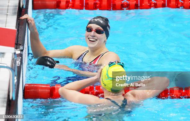 Ariarne Titmus of Team Australia and Katie Ledecky of Team United States react after competing in the Women's 400m Freestyle Final on day three of...