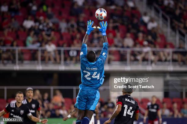 Bill Hamid of D.C. United makes a leaping save against the New York Red Bulls during the second half of the MLS game at Audi Field on July 25, 2021...