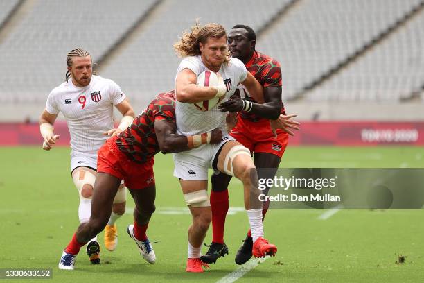 Joe Schroeder of Team United States is tackled on day three of the Tokyo 2020 Olympic Games at Tokyo Stadium on July 26, 2021 in Chofu, Tokyo, Japan.