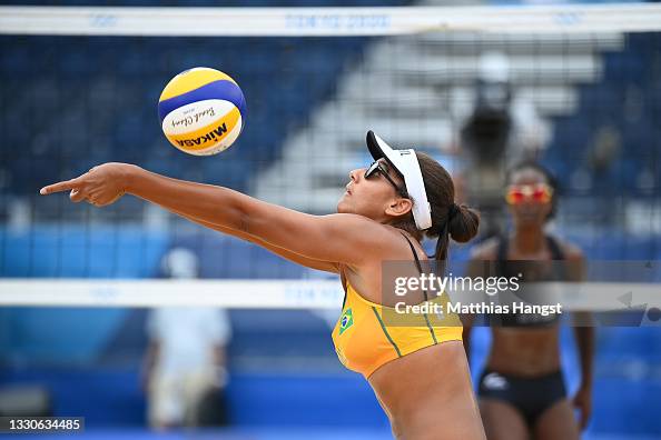 Ana Patricia Silva Ramos of Team Brazil returns the ball against Team