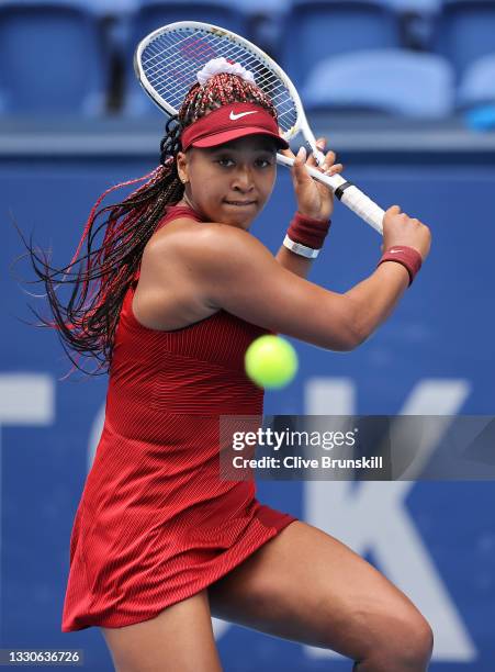 Naomi Osaka of Team Japan plays a backhand during her Women's Singles Second Round match against Viktorija Golubic of Team Switzerland on day three...