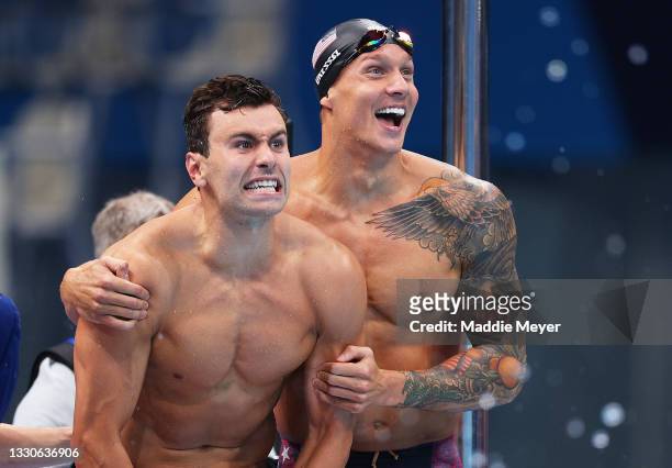 Blake Pieroni of Team United States and Caeleb Dressel of Team United States celebrate after winning the gold medal in the Men's 4 x 100m Freestyle...