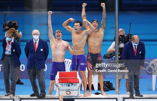 Bowen Becker, Blake Pieroni and Caeleb Dressel of Team United States celebrate winning the gold medal in the Men's 4 x 100m Freestyle Relay Final on...