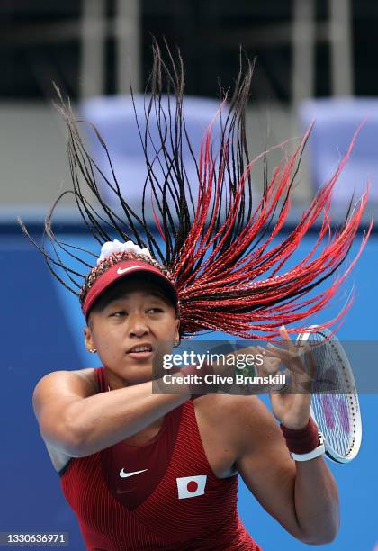 Naomi Osaka of Team Japan plays a forehand during her Women's Singles Second Round match against Viktorija Golubic of Team Switzerland on day three...