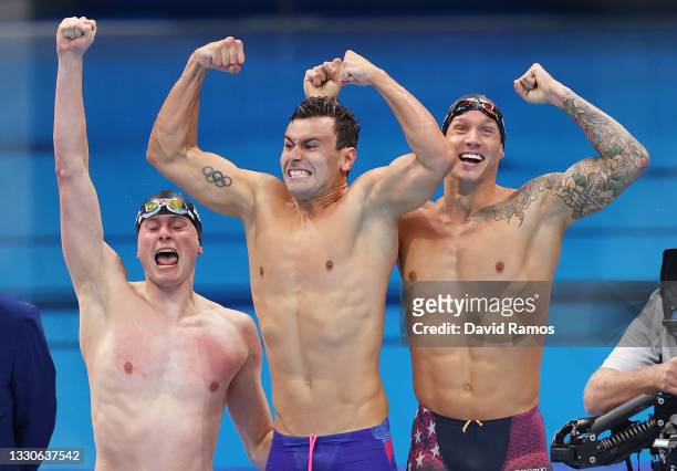 Bowen Becker, Blake Pieroni and Caeleb Dressel of Team United States celebrate after winning the gold medal in the Men's 4 x 100m Freestyle Relay...