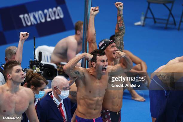 Blake Pieroni of Team United States and Caeleb Dressel of Team United States celebrate after winning the gold medal in the Men's 4 x 100m Freestyle...