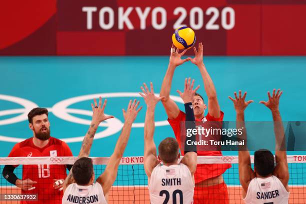 Dmitry Volkov of Team ROC attacks against Team United States during the Men's Preliminary Round - Pool B volleyball on day three of the Tokyo 2020...