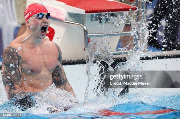 Adam Peaty of Team Great Britain celebrates after winning the gold medal in the Men's 100m Breaststroke Final on day three of the Tokyo 2020 Olympic...