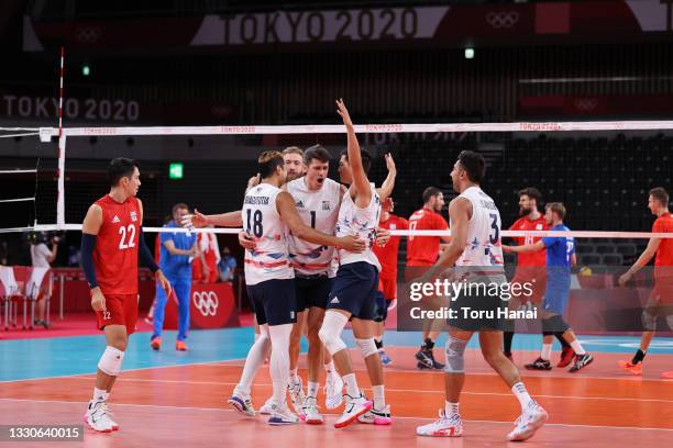 Team United States celebrates against Team ROC during the Men's Preliminary Round - Pool B volleyball on day three of the Tokyo 2020 Olympic Games at...