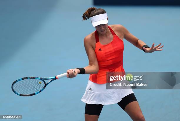 Garbine Muguruza of Team Spain plays a forehand during her Women's Singles Second Round match against Qiang Wang of Team China on day three of the...