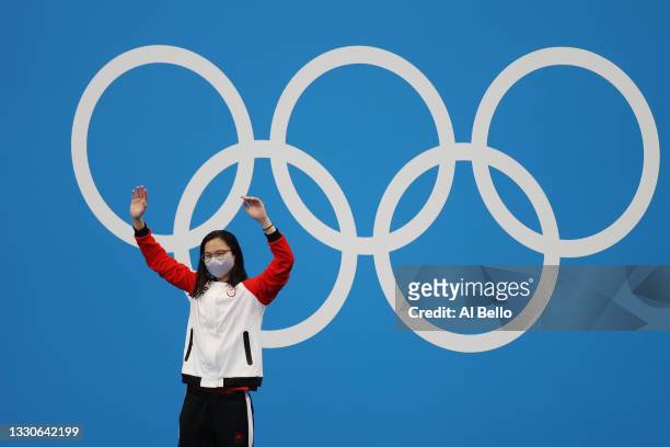 Margaret Macneil of Team Canada poses with the gold medal for the Women's 100m Butterfly Final on day three of the Tokyo 2020 Olympic Games at Tokyo...