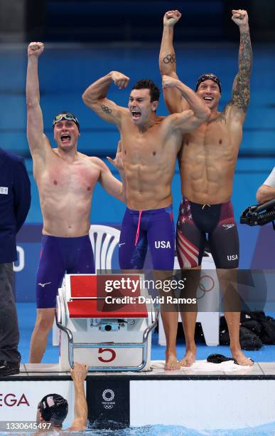 Bowen Becker, Blake Pieroni, Caeleb Dressel and Zach Apple of Team United States react after competing in the Men's 4 x 100m Freestyle Relay Final on...